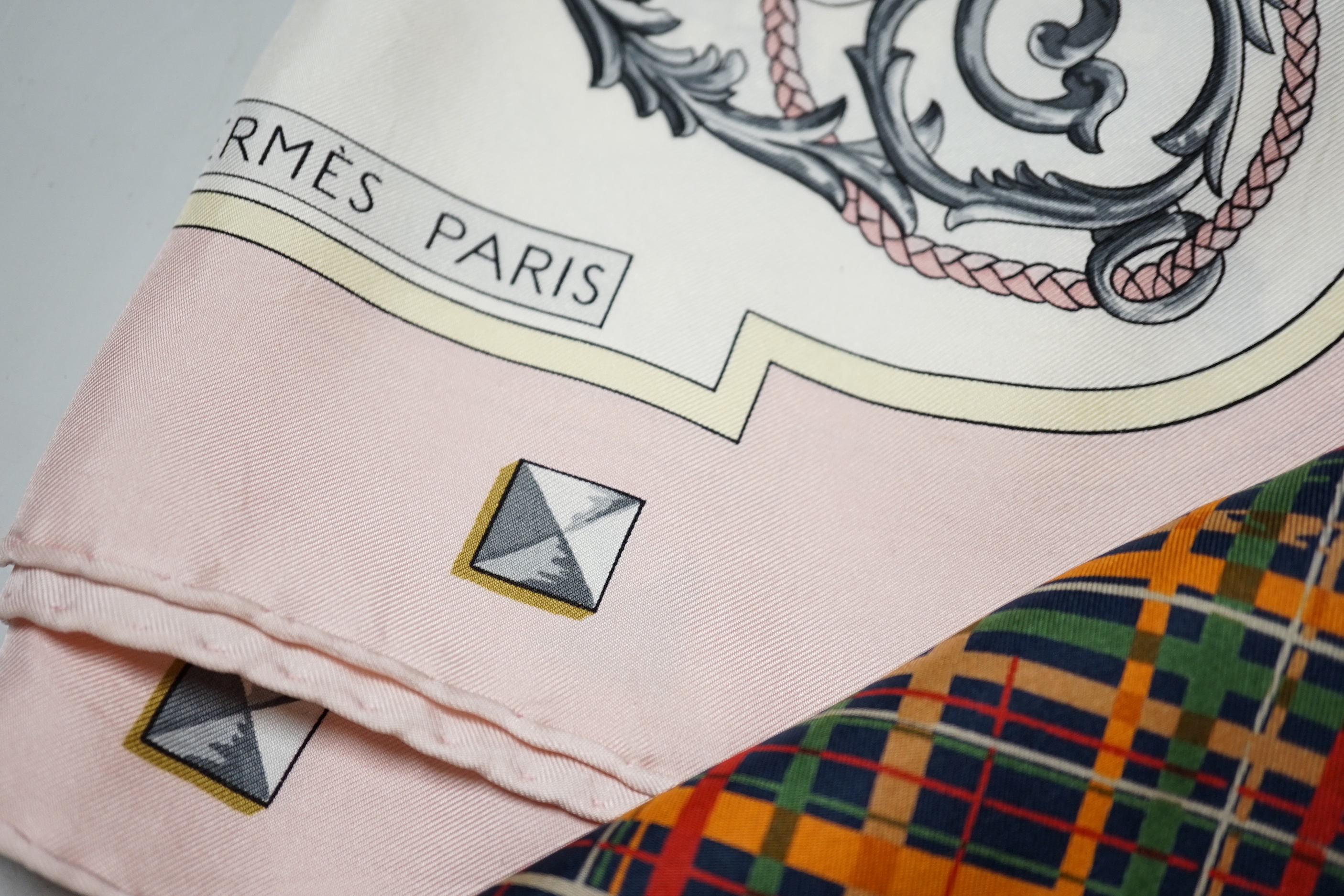 A Hermes, Paris silk scarf “Les Cles Bordeaux” with pink border and three Christian Dior silk scarves